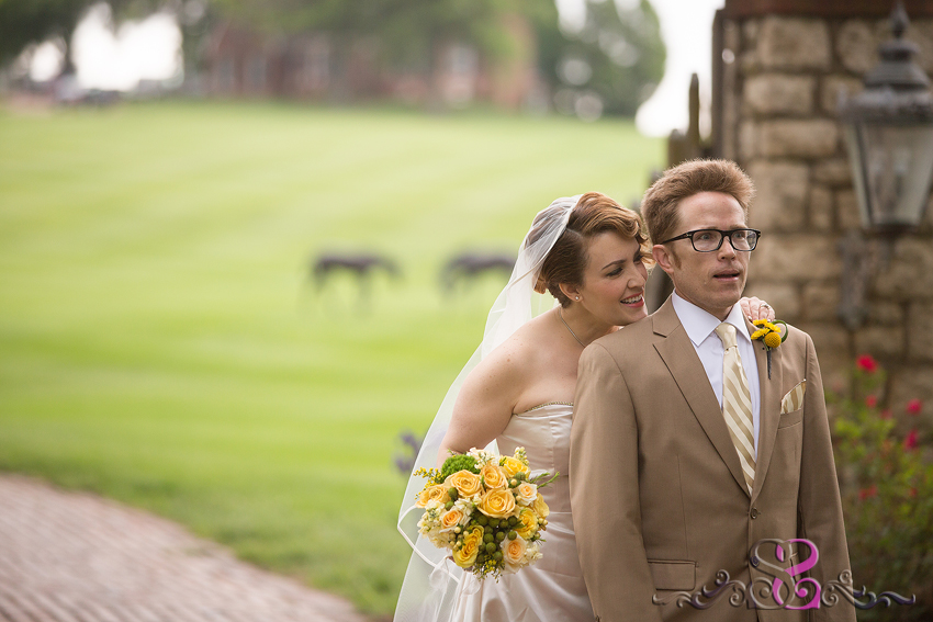 14 - bride whispers in grooms ear for first look grand rapids michigan wedding photographer