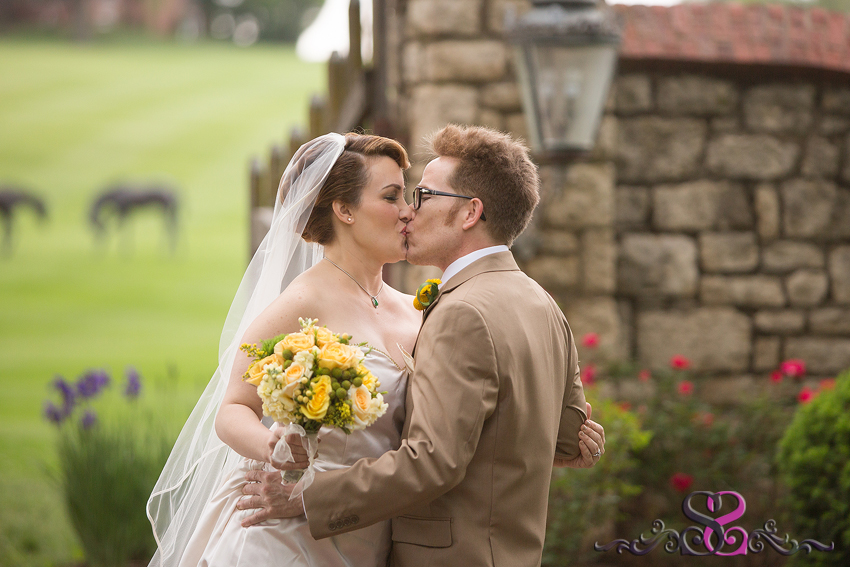 15 - bride and groom share a kiss during first look grand rapids michigan wedding photographer