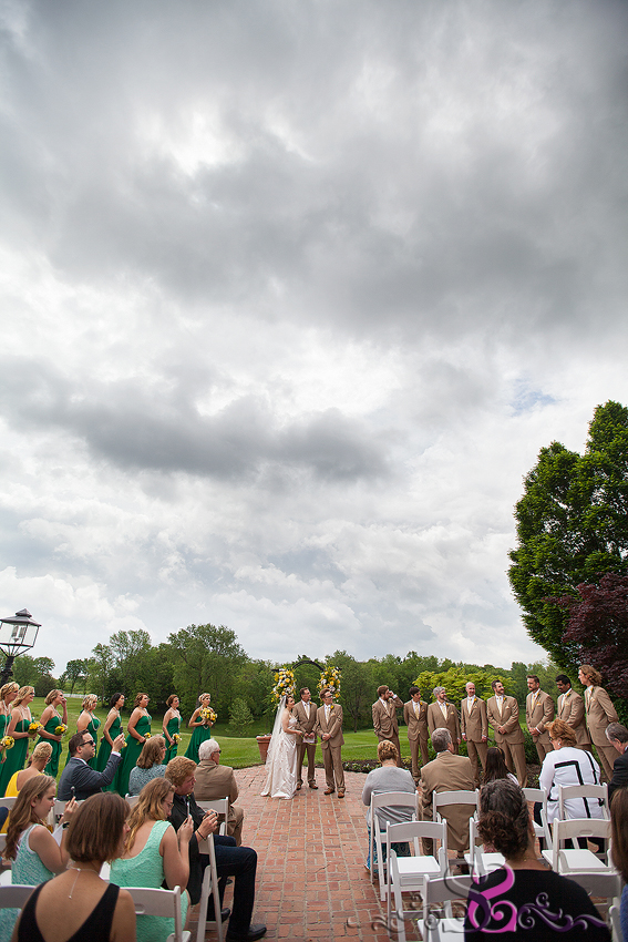 29 - wide shot of ceremony with dramatic sky grand rapids michigan wedding photographer