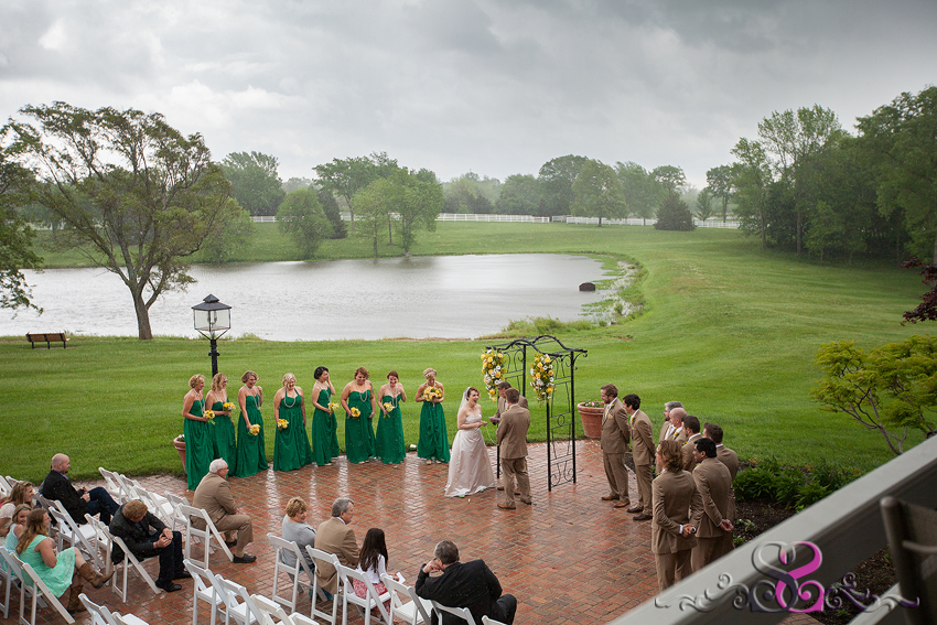 32 - wide shot of rainy ceremony with brick patio near lake kansas photographer