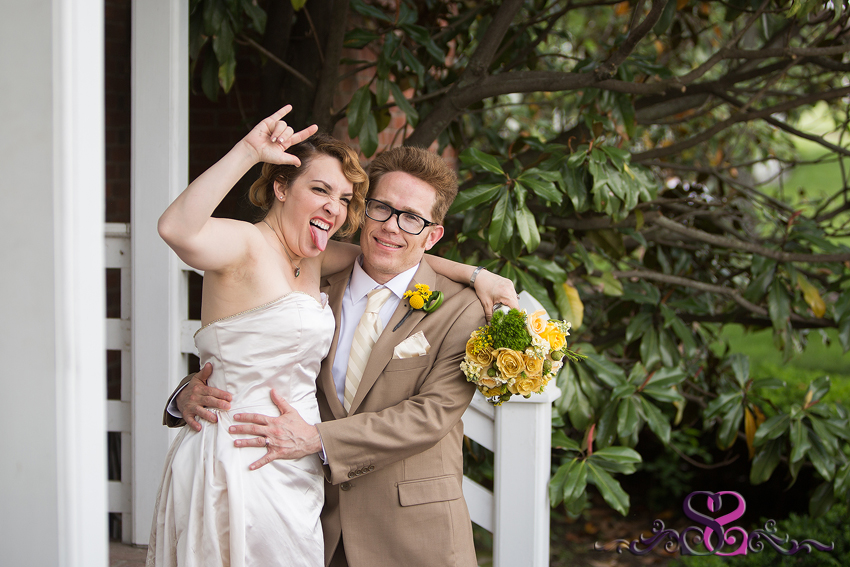 57 - rocker bride celebrates with groom on white porch kansas photographer