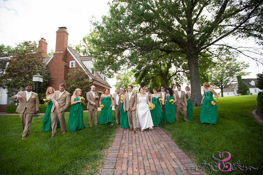 59 - bridal party walk on brick pathway grand rapids michigan wedding photographer