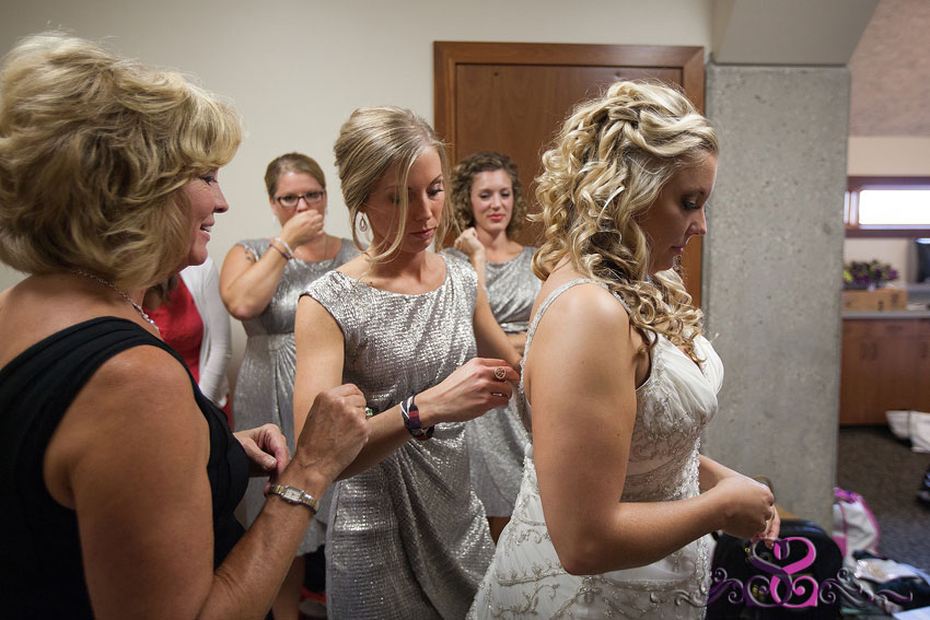 03-bride-getting-dressed-with-mom-and-bridesmaids-lawrence-wedding-photographer
