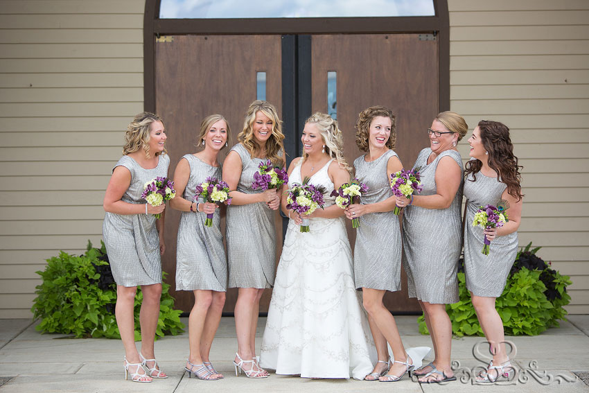11-bride-laughing-with-bridesmaids-in-silver-dresses-michigan-wedding-photographer