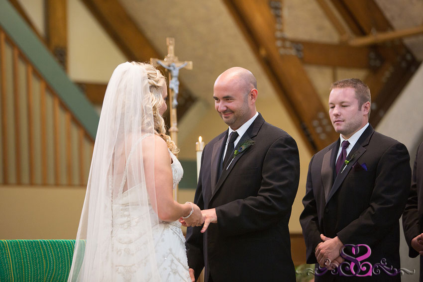 20-groom-looking-at-bride-during-ceremony-kansas-photographer