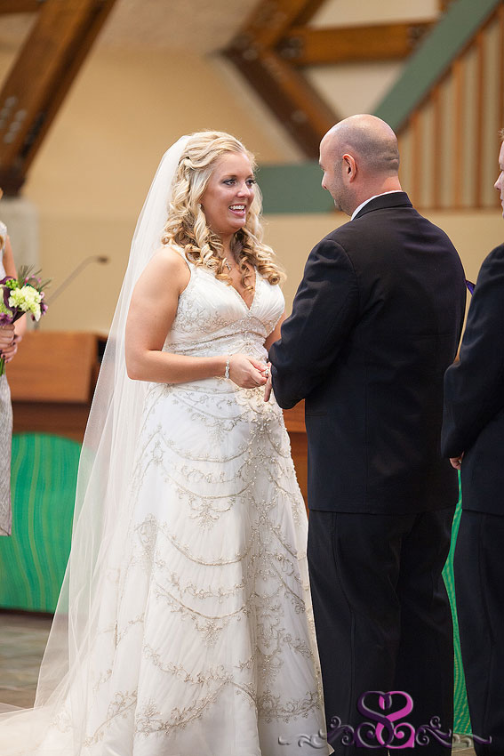 21-bride-smiling-at-groom-during-vows-michigan-wedding-photographer
