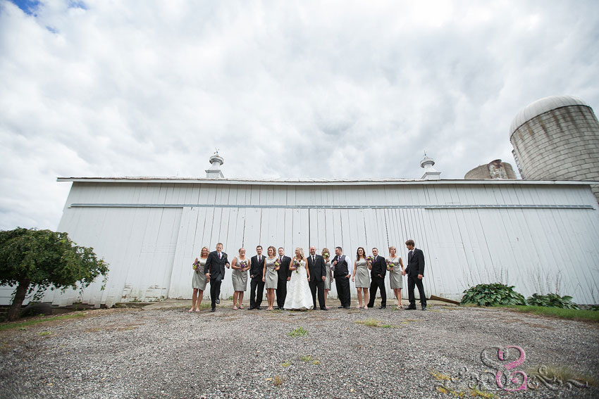 27-bridal-party-in-front-of-barn-with-dramatic-sky-michigan-photographer