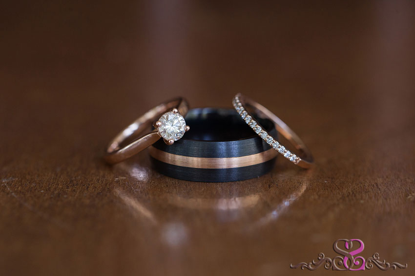06-rose gold wedding ring and black band with gold grand rapids photographer