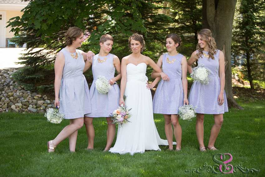 19-bride and bridesmaids trying to be serious destination wedding photographer