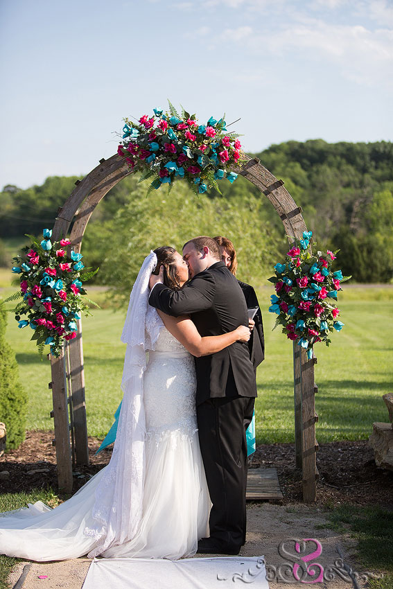 24-bride-and-groom-kiss-during-ceremony-lawrence-photographer