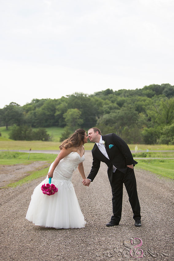 30-bride-and-groom-almost-kiss-on-dirt-path-lawrence-photographer