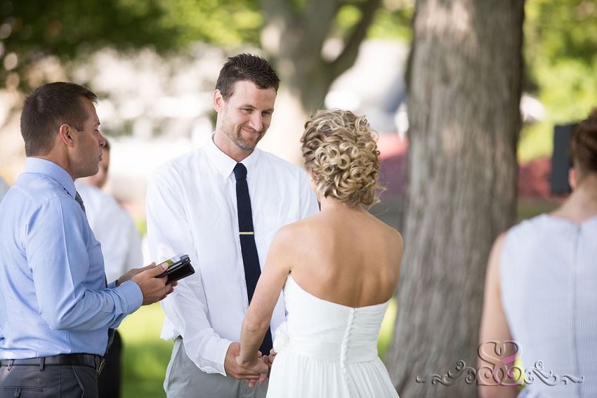 32-groom smiles at bride grand rapids michigan photographer