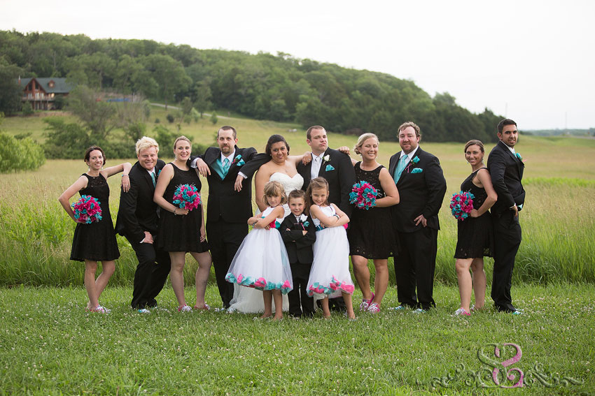 33-wedding-party-strikes-pose-in-field-michigan-wedding-photographer
