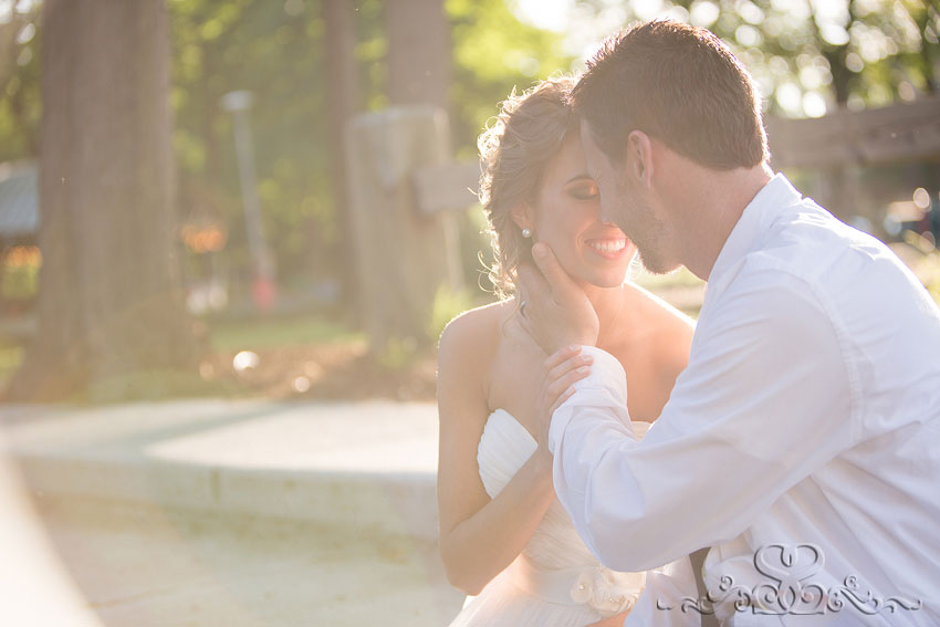 48-bride and groom embrace awashed in sunlight grand rapids photographer