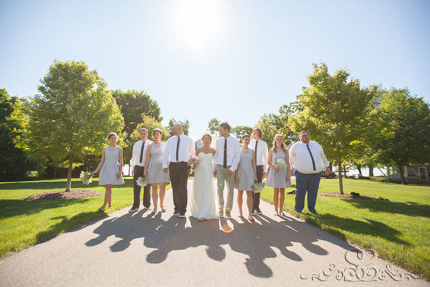 53-wedding party walks in sunlight lawrence wedding photographer