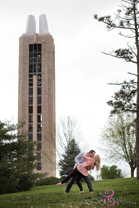 13-engaged couple kiss in front of campanile kansas wedding photographer