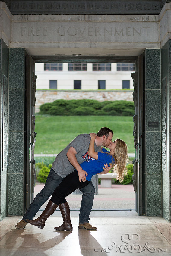 16-engaged couple dip kiss under campanile grand rapids wedding photographer kansas university campus engagement session