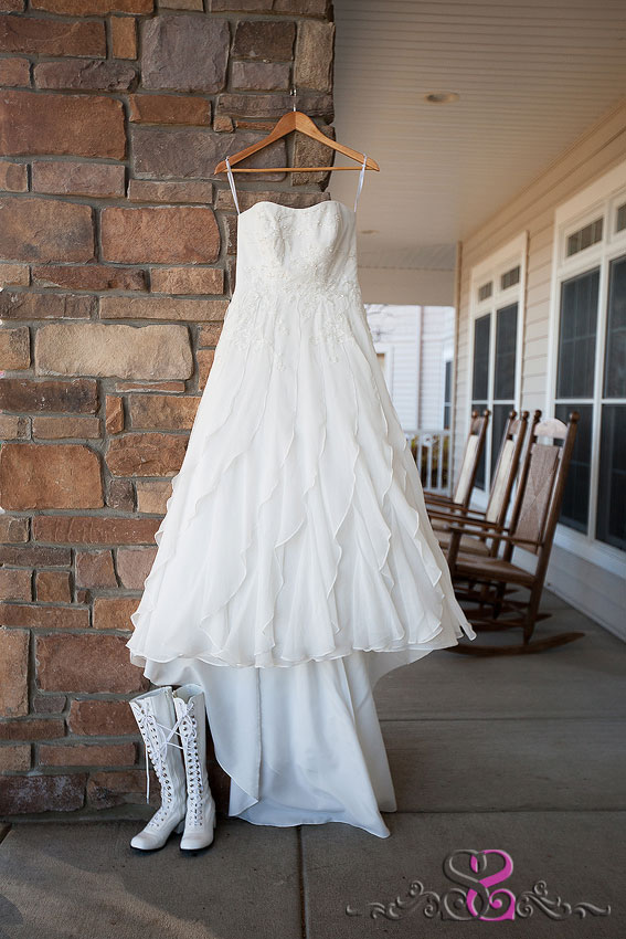 03-brides-dress-hangs-on-porch-with-boots-grand-rapids-photographer