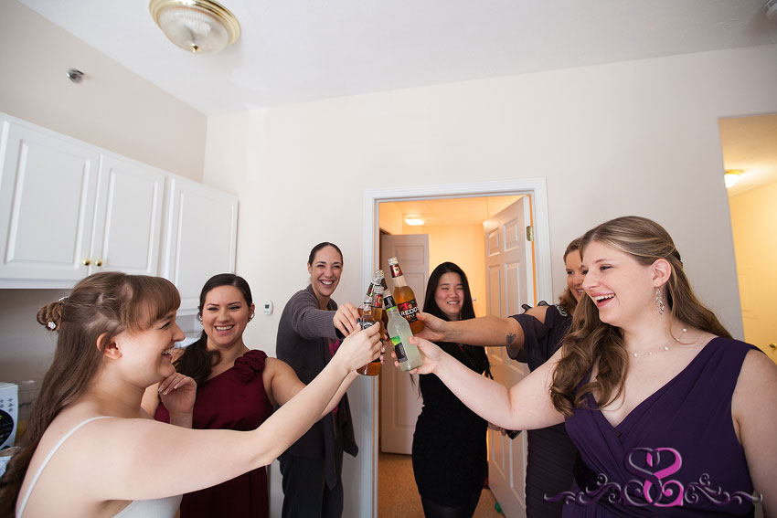 05-bridesmaids-cheers-drinks-while-getting-ready-grand-rapids-photographer