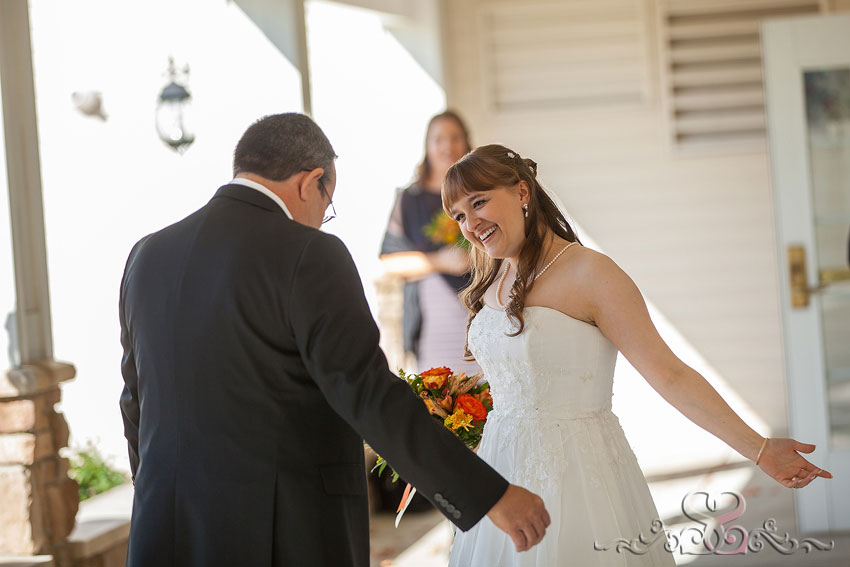10-bride-smiles-at-father-first-look-grand-rapids-photographer