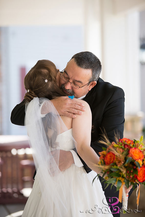 11-father-hugs-bride-grand-rapids-wedding-photographer