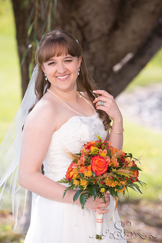 13-bridal-portrait-with-orange-and-yellow-fall-bouquet-grand-rapids-wedding-photographer