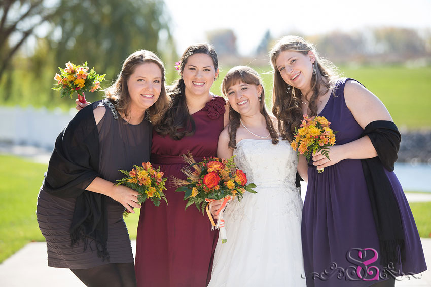 14-bridesmaids-smile-in-sunlight-grand-rapids-wedding-photographer-Fall-Wedding-at-Waterford-Crossing-Goshen-IN