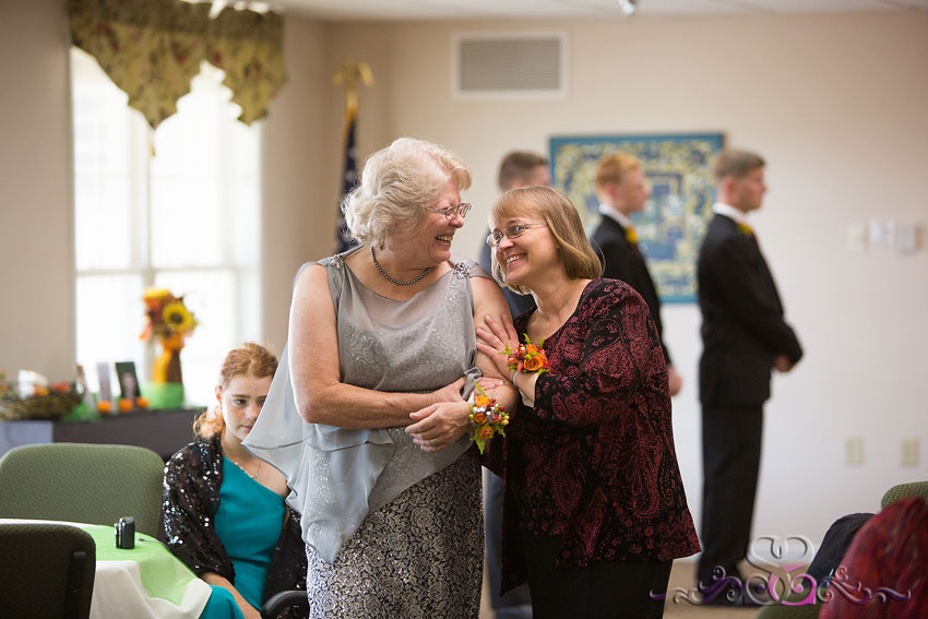 16-mothers-of-bride-and-groom-laugh-with-each-other-grand-rapids-wedding-photographer