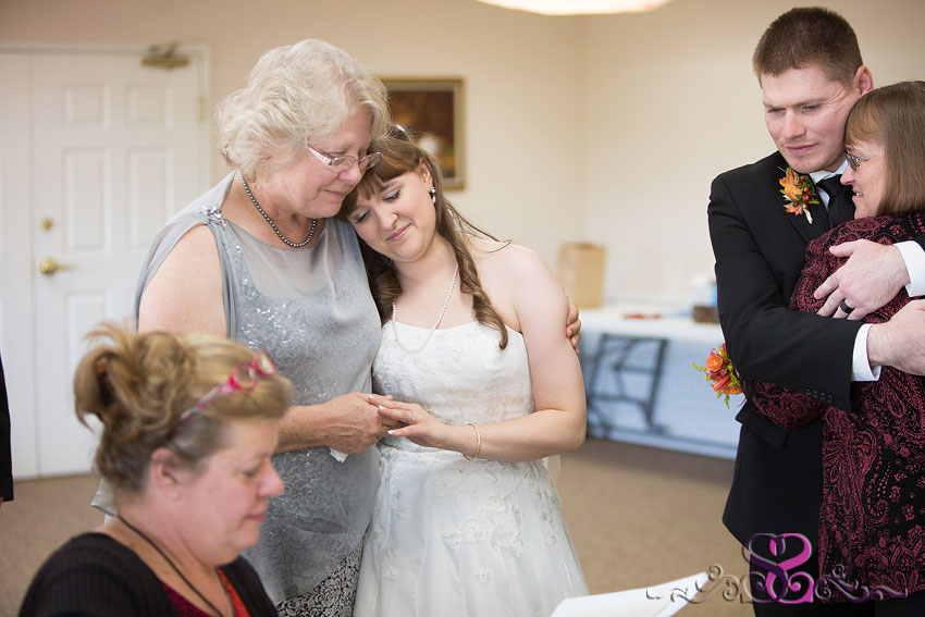 27-bride-hugs-mother-of-groom-michigan-wedding-photographer