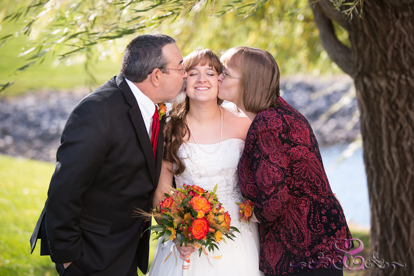 28-bride-gets-kissed-by-mom-and-dad-michigan-wedding-photographer