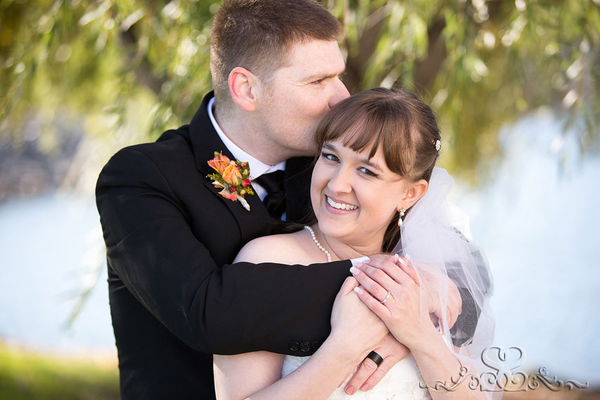 36-bride-smiles-with-groom-kisses-her-michigan-photographer