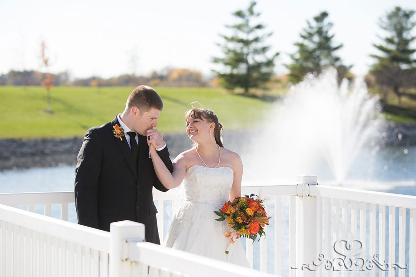 39-bride-and-groom-share-moment-in-front-of-fountain-michigan-photographer