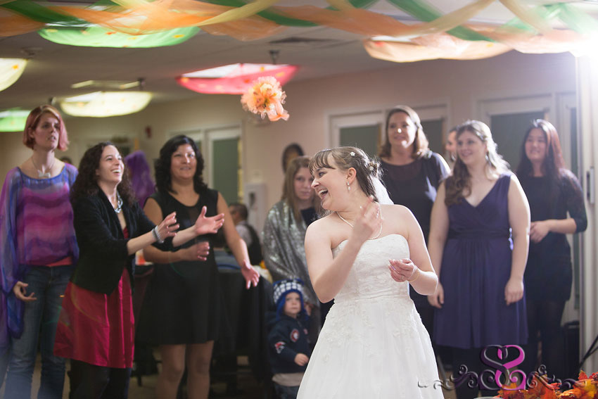 61-bride-tosses-bouquet-indiana-wedding-photographer-Fall-Wedding-at-Waterford-Crossing-Goshen-IN